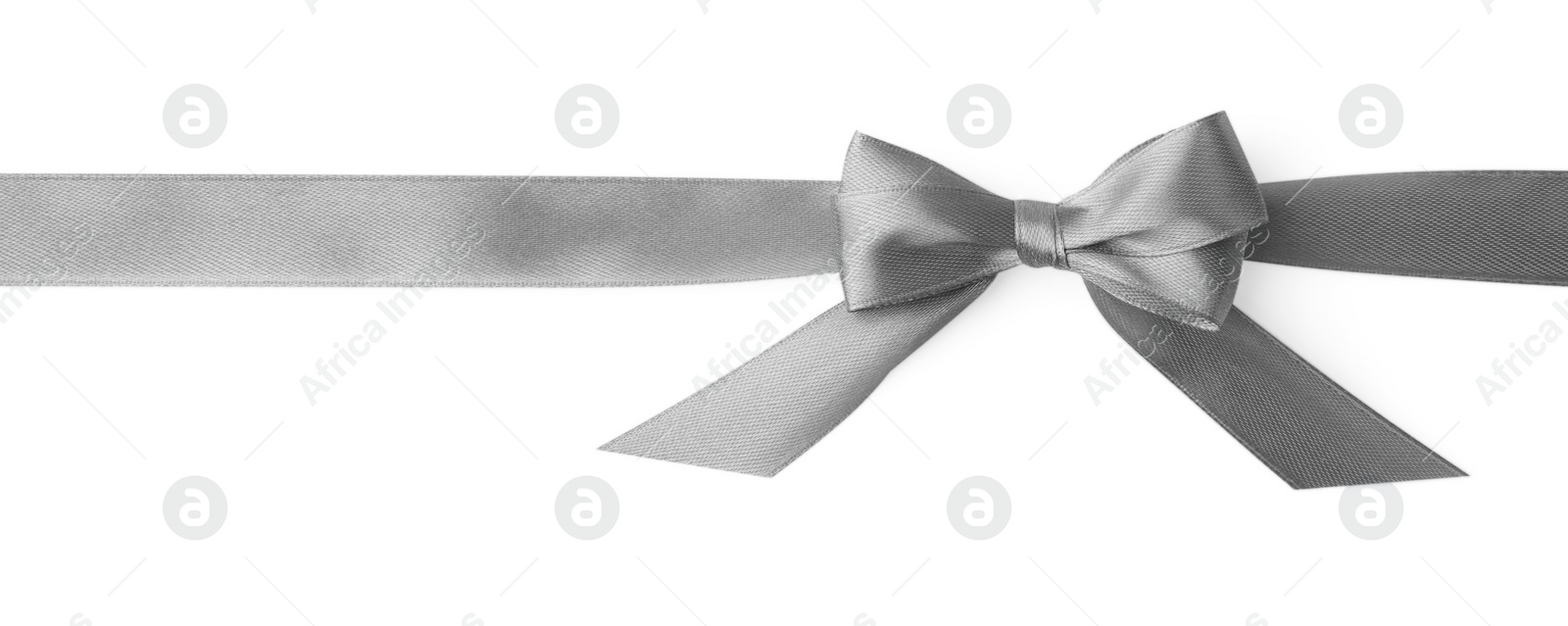 Photo of Grey satin ribbon with bow on white background, top view