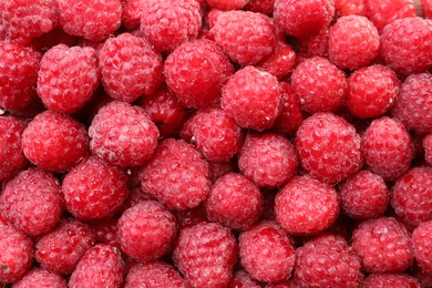 Photo of Heap of tasty ripe raspberries as background, top view