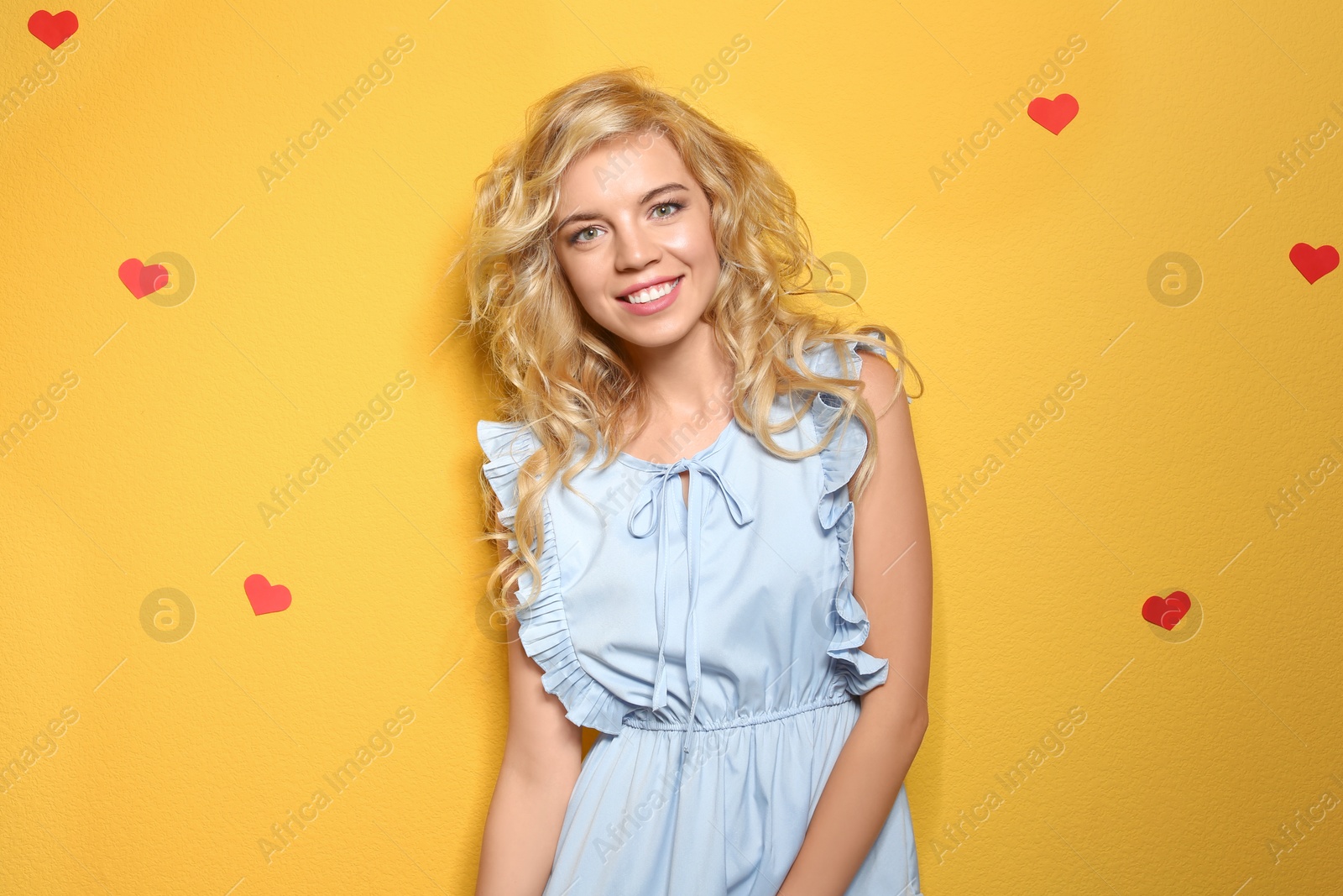 Photo of Stylish young woman posing on color background