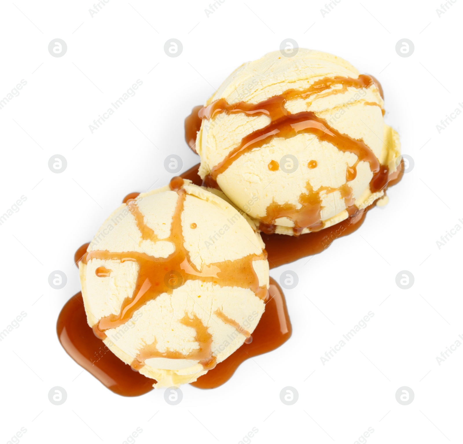 Photo of Delicious ice cream with caramel sauce on white background, top view