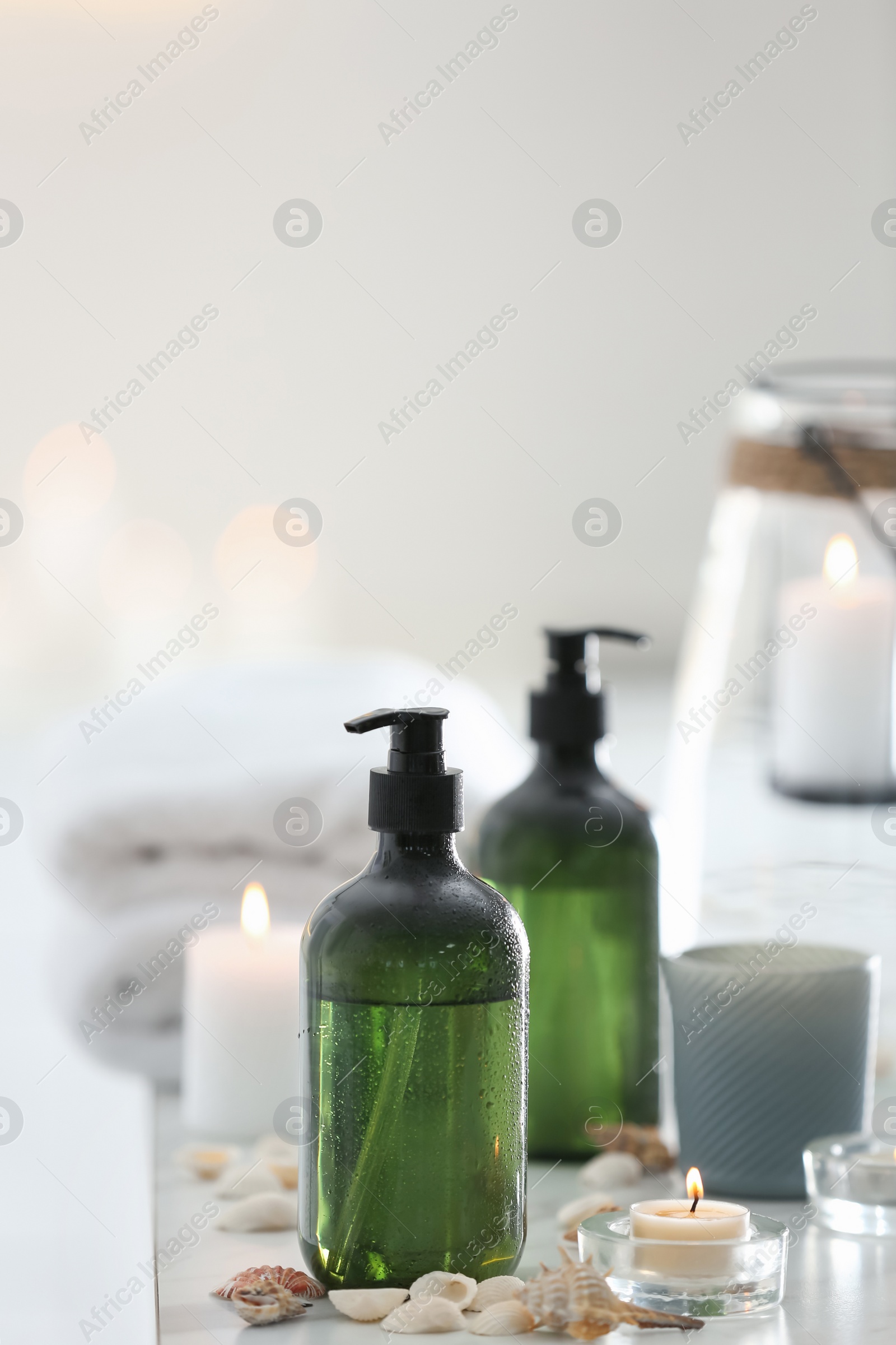 Photo of Soap dispensers and decor elements on table