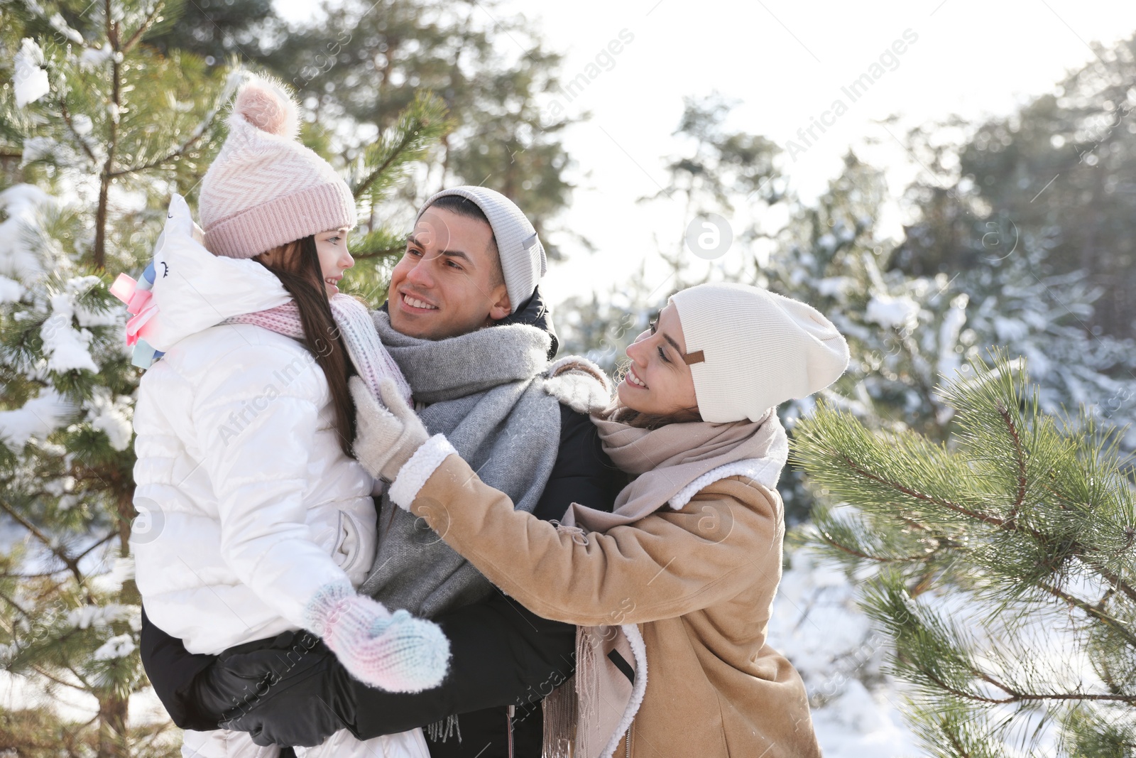 Photo of Happy family outdoors on winter day. Christmas vacation