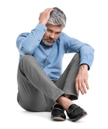 Photo of Mature businessman in stylish clothes sitting on white background