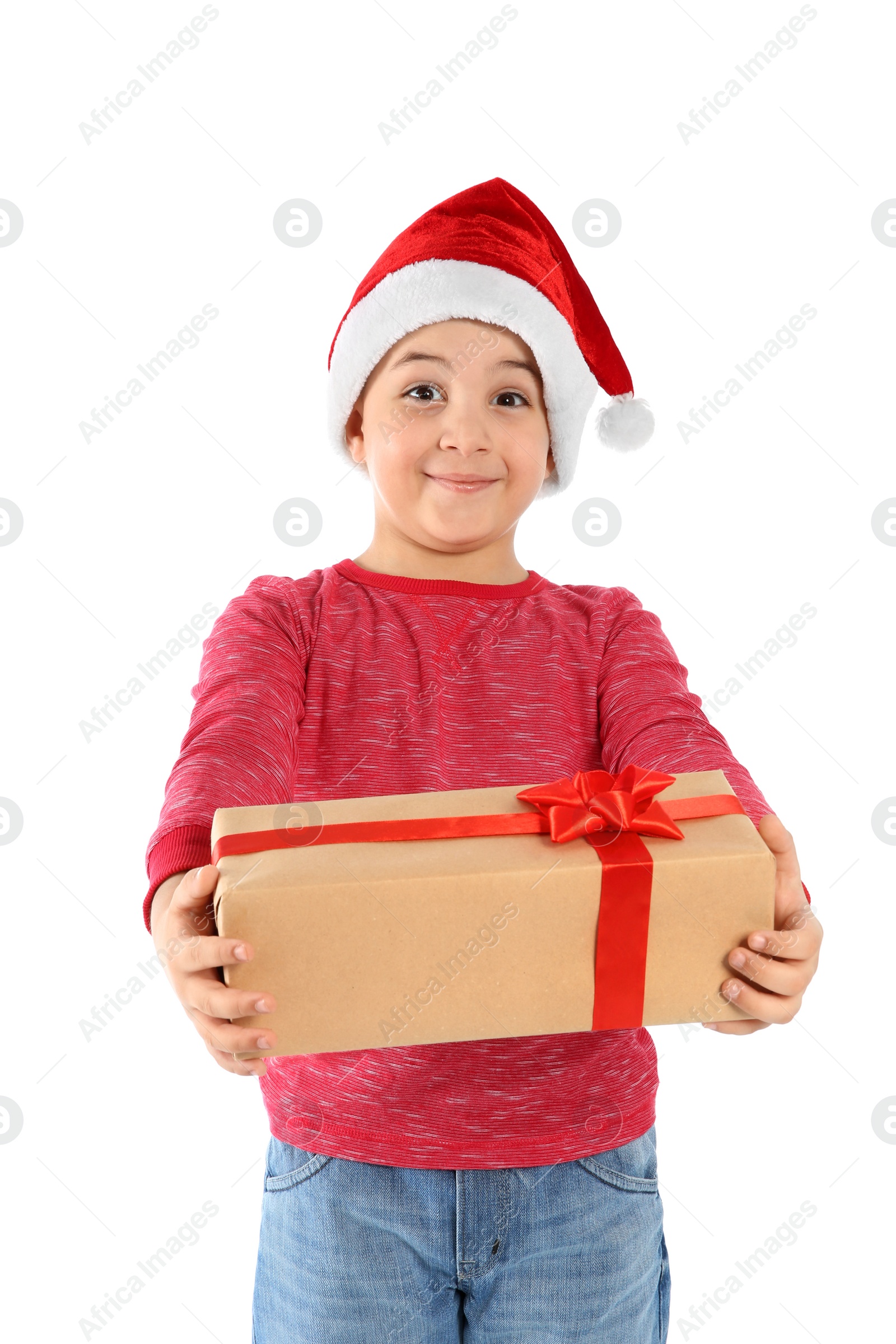 Photo of Cute little child in Santa hat with Christmas gift on white background