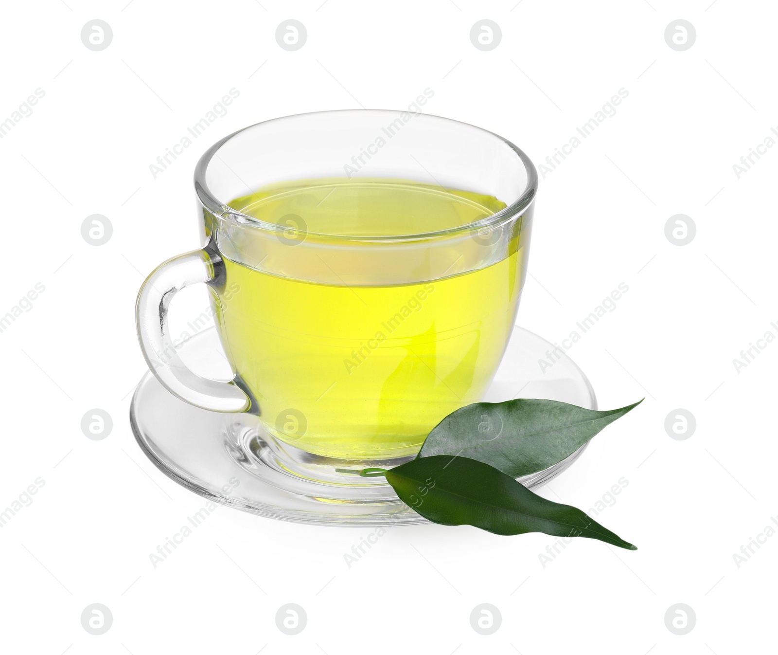 Photo of Fresh green tea in glass cup, leaves and saucer isolated on white