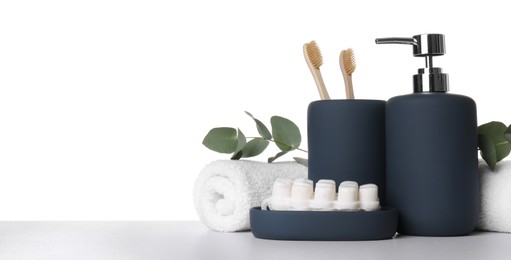 Photo of Bath accessories. Different personal care products and eucalyptus branches on table against white background. Space for text