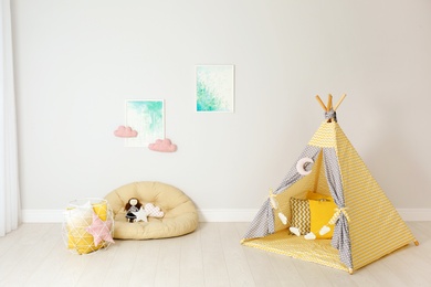 Modern nursery room interior with play tent for kids