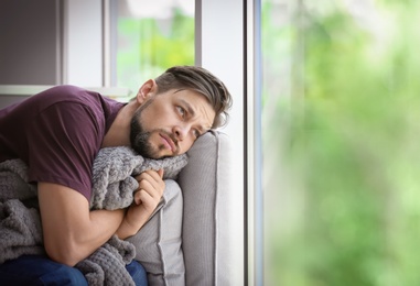 Lonely man suffering from depression at home