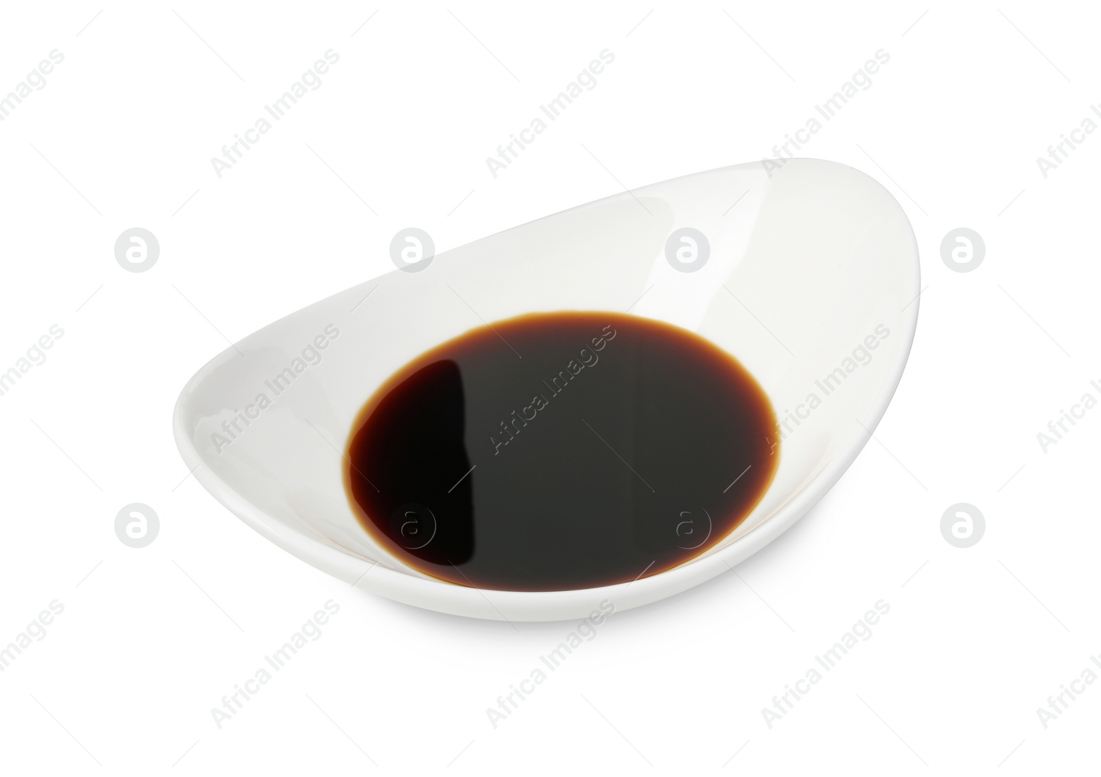 Photo of Tasty soy sauce in gravy boat isolated on white