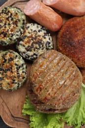 Photo of Different tasty vegan meat products on wooden board, flat lay