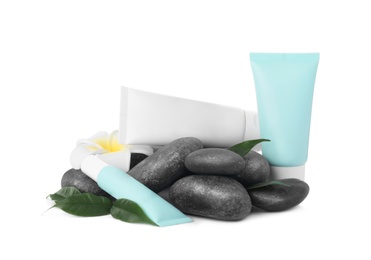 Cosmetic products, flower and spa stones on white background