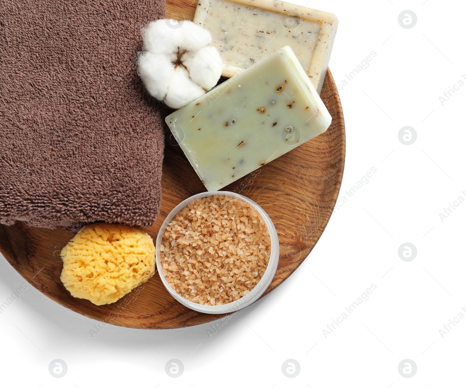 Photo of Plate with spa cosmetics and towel on white background, top view