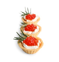 Photo of Delicious tartlets with red caviar and cream cheese on white background