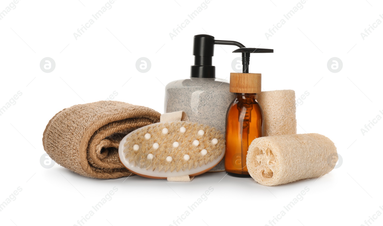 Photo of Set of toiletries with natural loofah sponges on white background