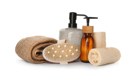 Photo of Set of toiletries with natural loofah sponges on white background