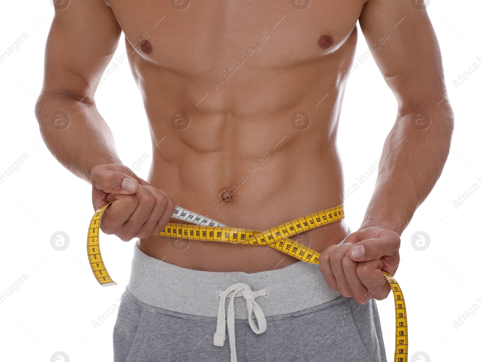 Photo of Shirtless man with slim body and measuring tape around his waist isolated on white, closeup