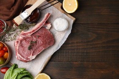 Photo of Flat lay composition with raw meat, thyme and marinade on wooden table. Space for text