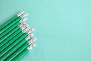 Photo of Pencils on mint color background