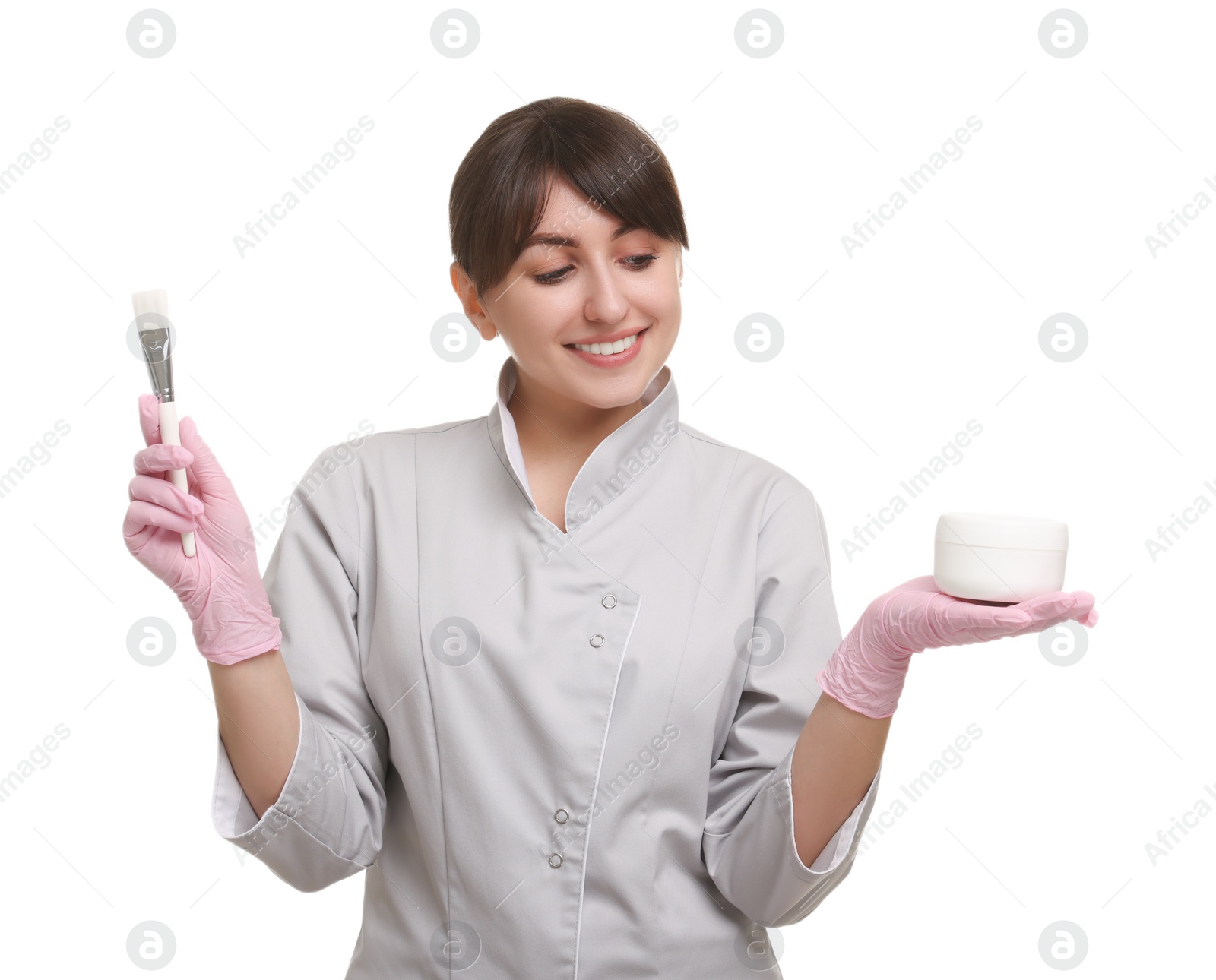 Photo of Cosmetologist with cosmetic product and brush on white background