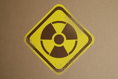 Radioactive sign on brown background. Hazard symbol