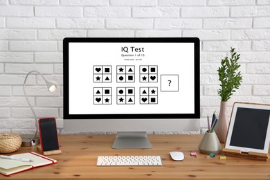 Image of Modern computer with IQ test on screen in office