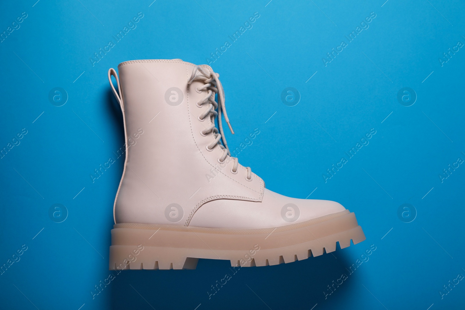 Photo of Stylish leather shoe on light blue background, top view