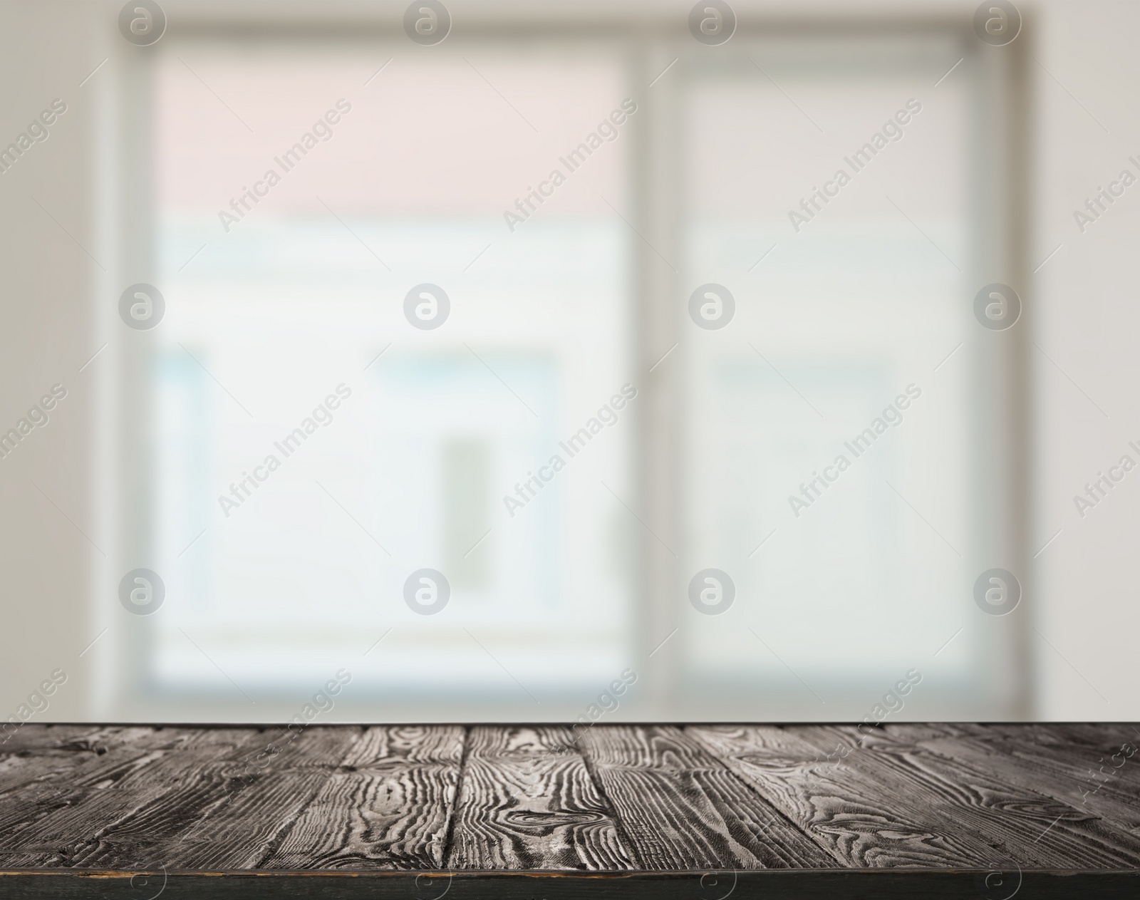 Image of Empty wooden surface and blurred view of modern window 