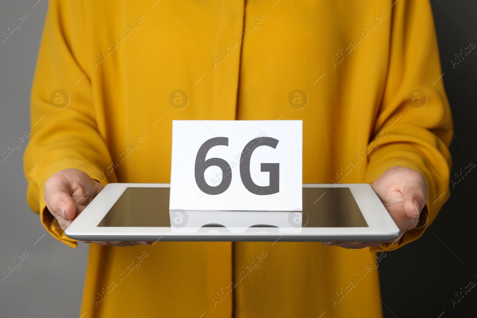 Photo of 6G technology, Internet concept. Woman holding tablet with card, closeup