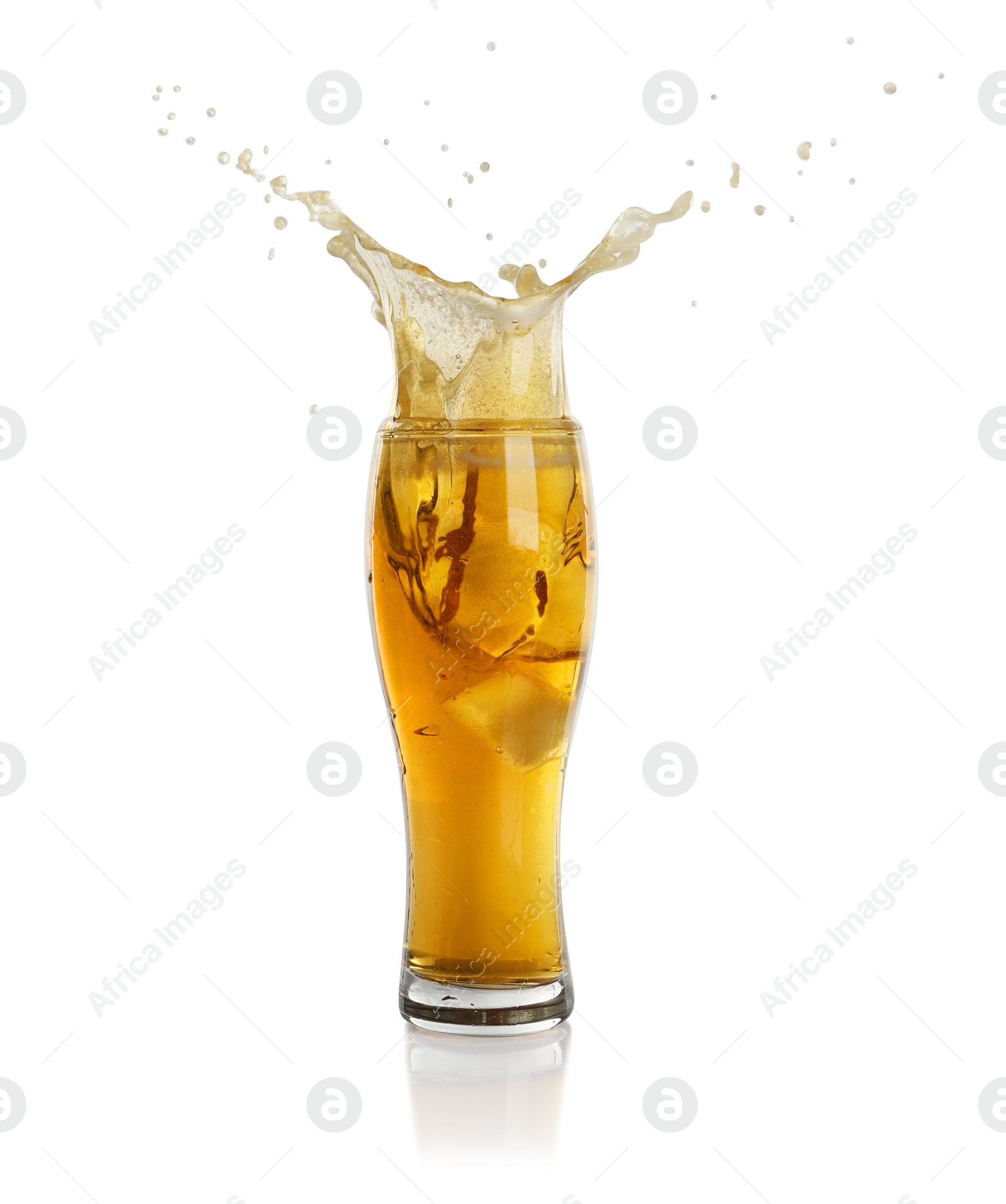 Photo of Beer splashing out of glass on white background