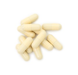 Vitamin capsules isolated on white, top view. Health supplement