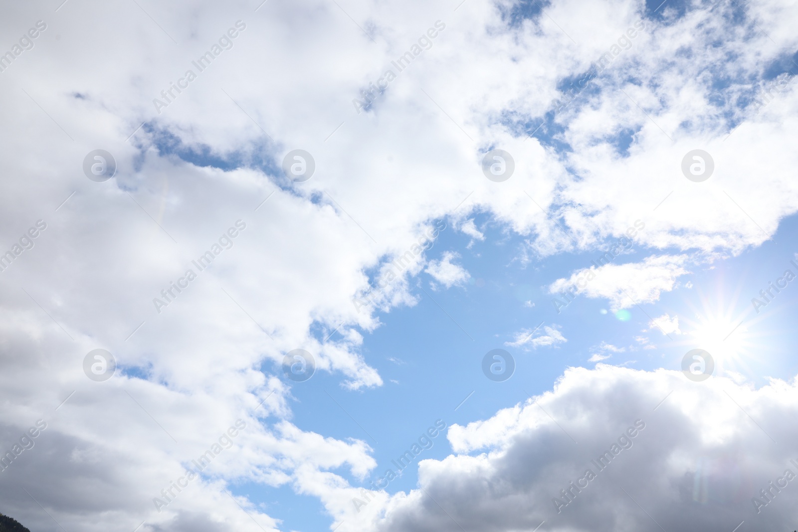 Photo of View of beautiful blue sky with white fluffy clouds