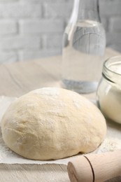 Photo of Cooking scones with soda water. Dough and ingredients on white wooden table