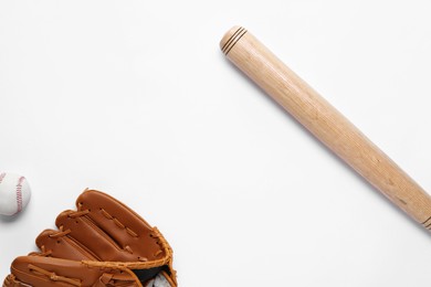 Baseball glove, bat and ball on white background, flat lay. Space for text