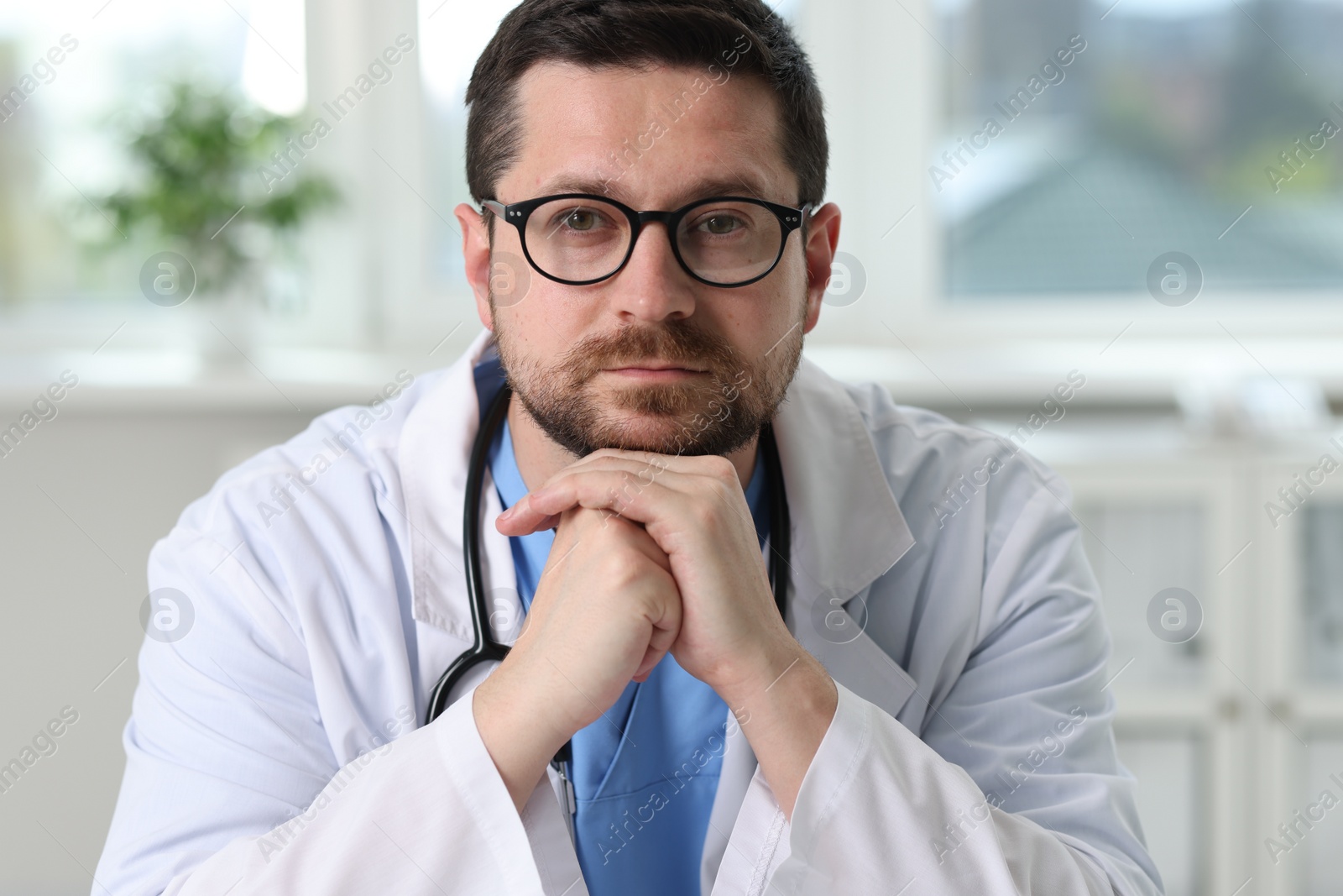 Photo of Portrait of doctor with stethoscope in clinic