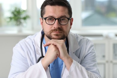 Portrait of doctor with stethoscope in clinic