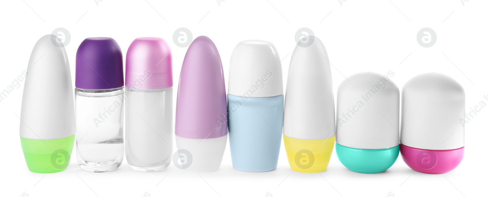 Photo of Set of different female roll-on deodorants on white background