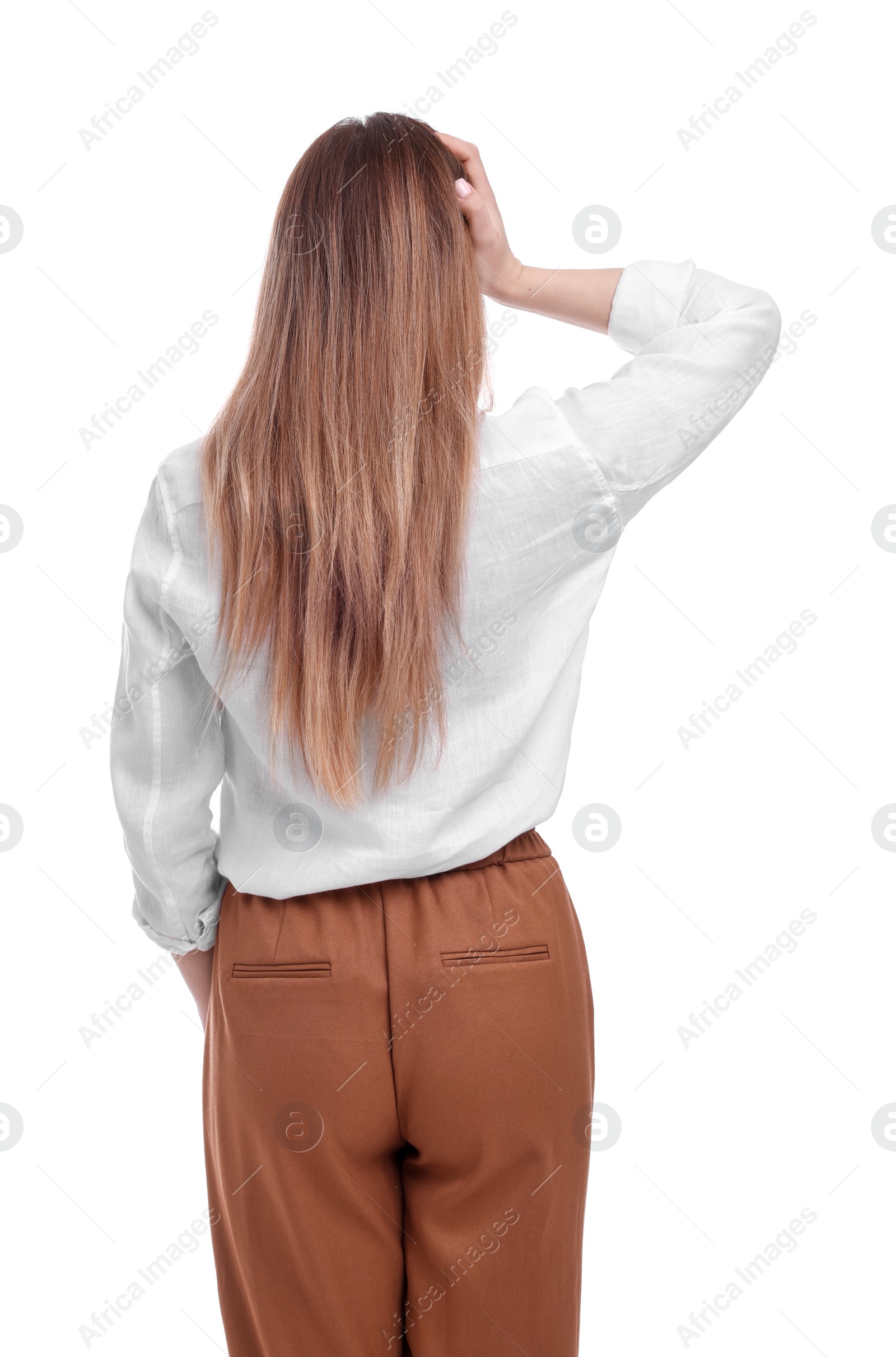 Photo of Businesswoman standing on white background, back view