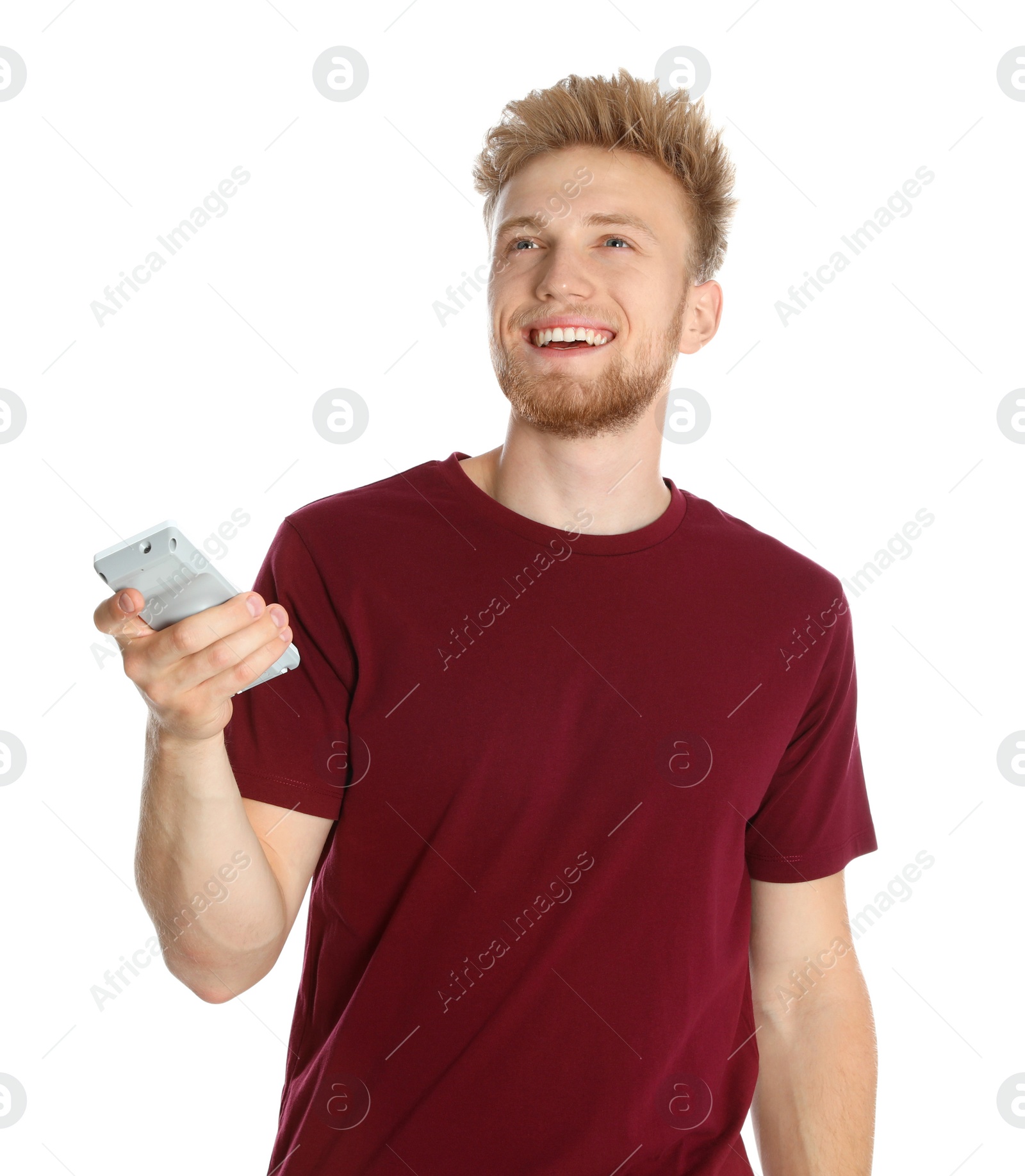 Photo of Young man with air conditioner remote on white background