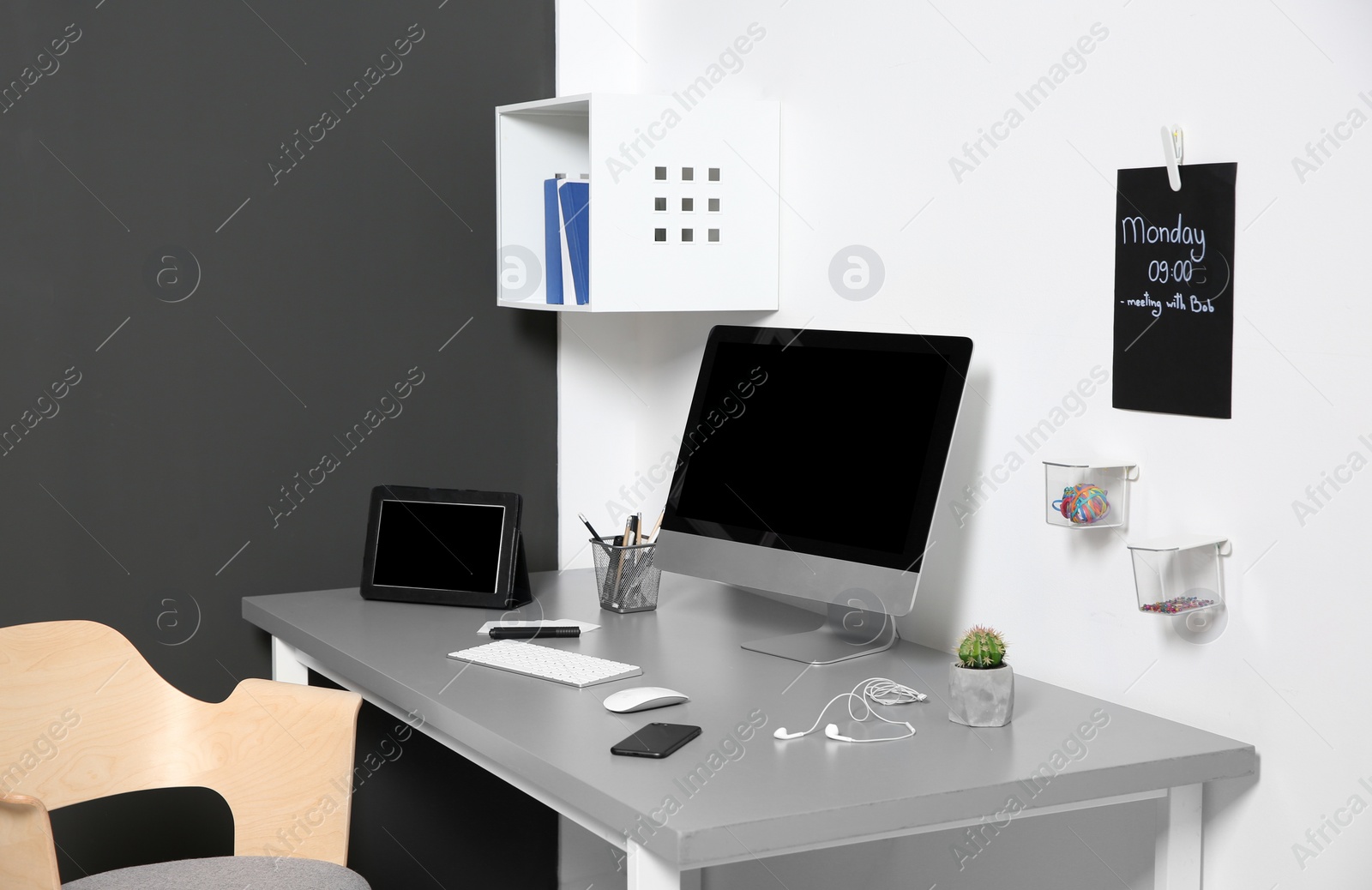 Photo of Modern interior of workplace with computer and accessories