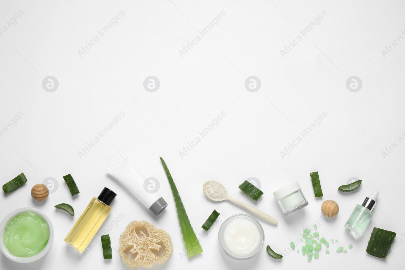 Photo of Flat lay composition with aloe vera and cosmetic products on white background