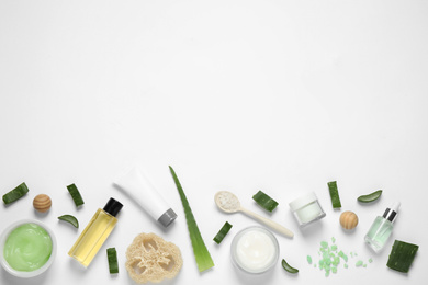 Flat lay composition with aloe vera and cosmetic products on white background