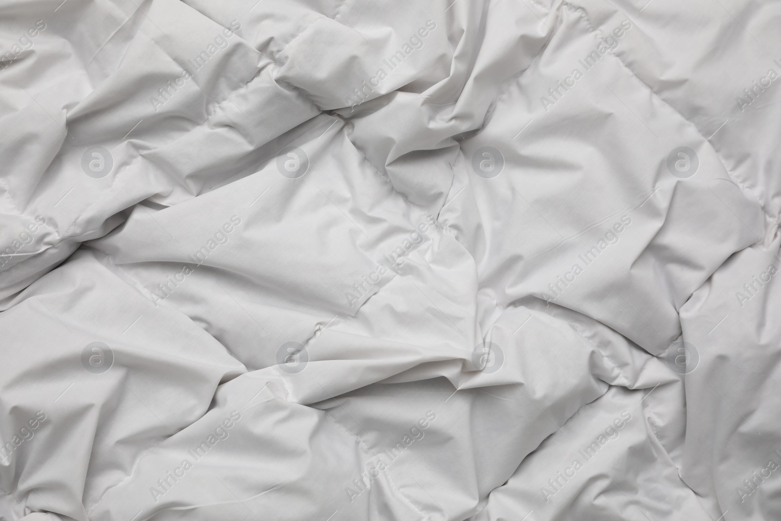 Photo of Soft crumpled blanket as background, top view