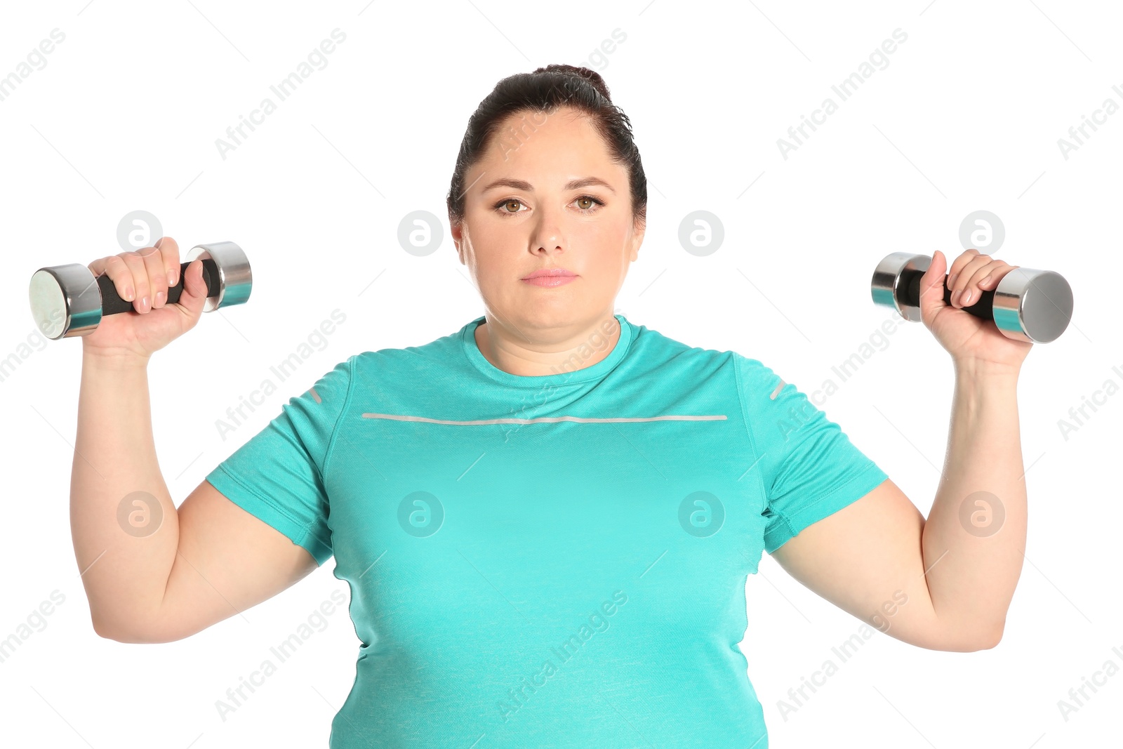 Photo of Overweight woman doing exercise with dumbbells on white background