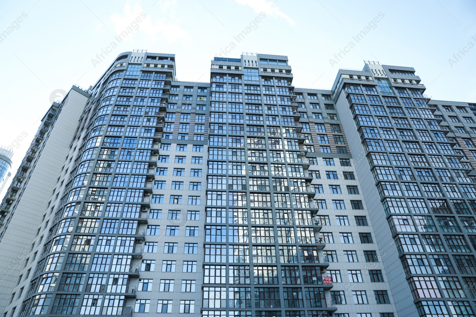 Photo of KYIV, UKRAINE - MAY 21, 2019: Beautiful view of modern housing estate in Pecherskyi district on sunny day, low angle