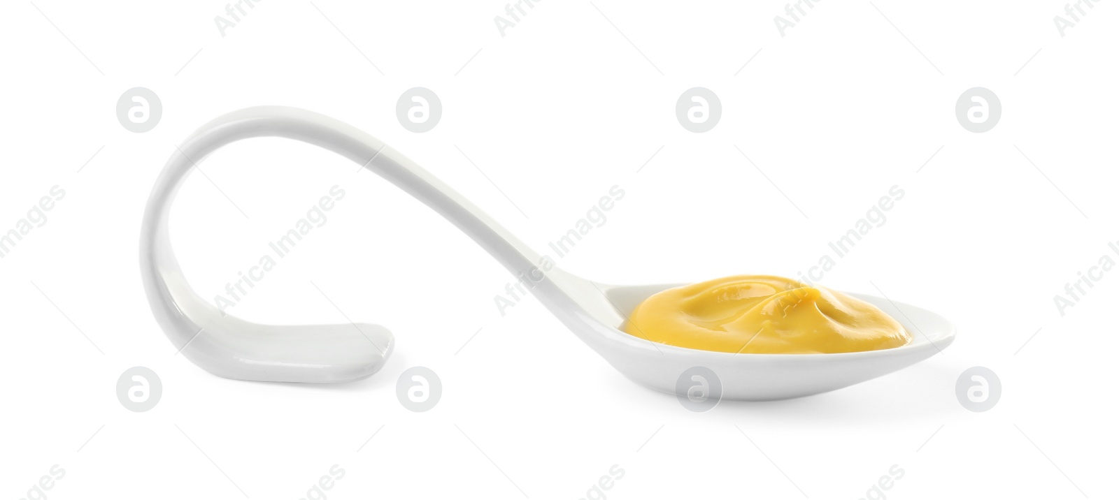 Photo of Mustard in ceramic serving spoon isolated on white