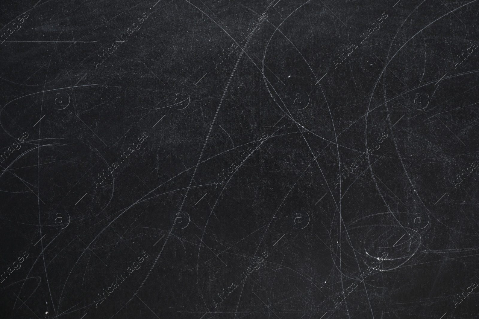 Photo of Chalk rubbed out on blackboard as background, closeup. Space for text