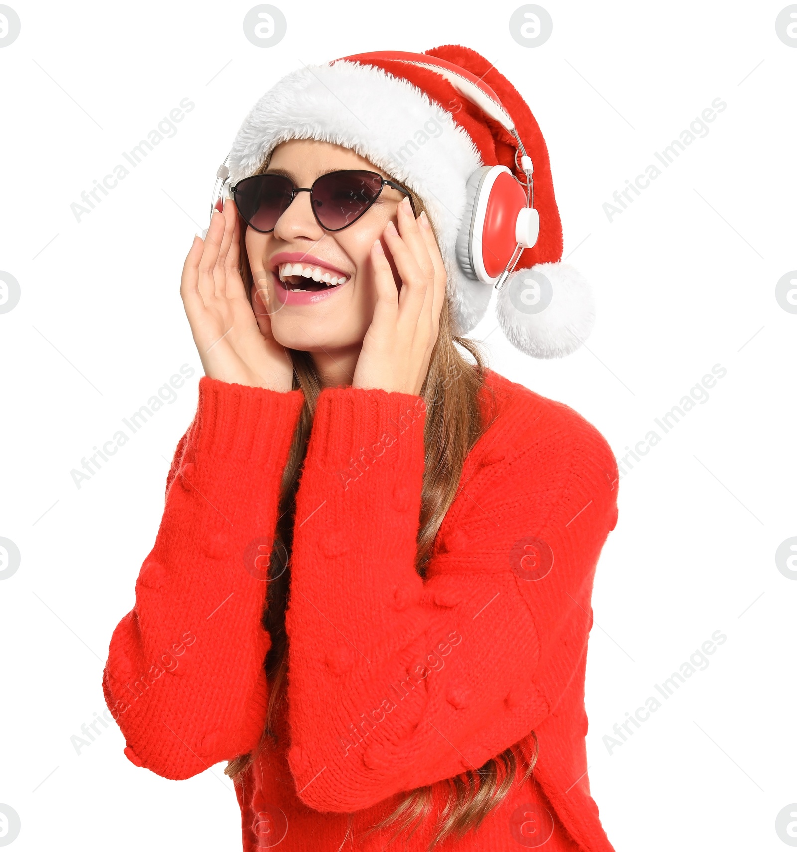 Photo of Happy young woman listening to Christmas music on white background