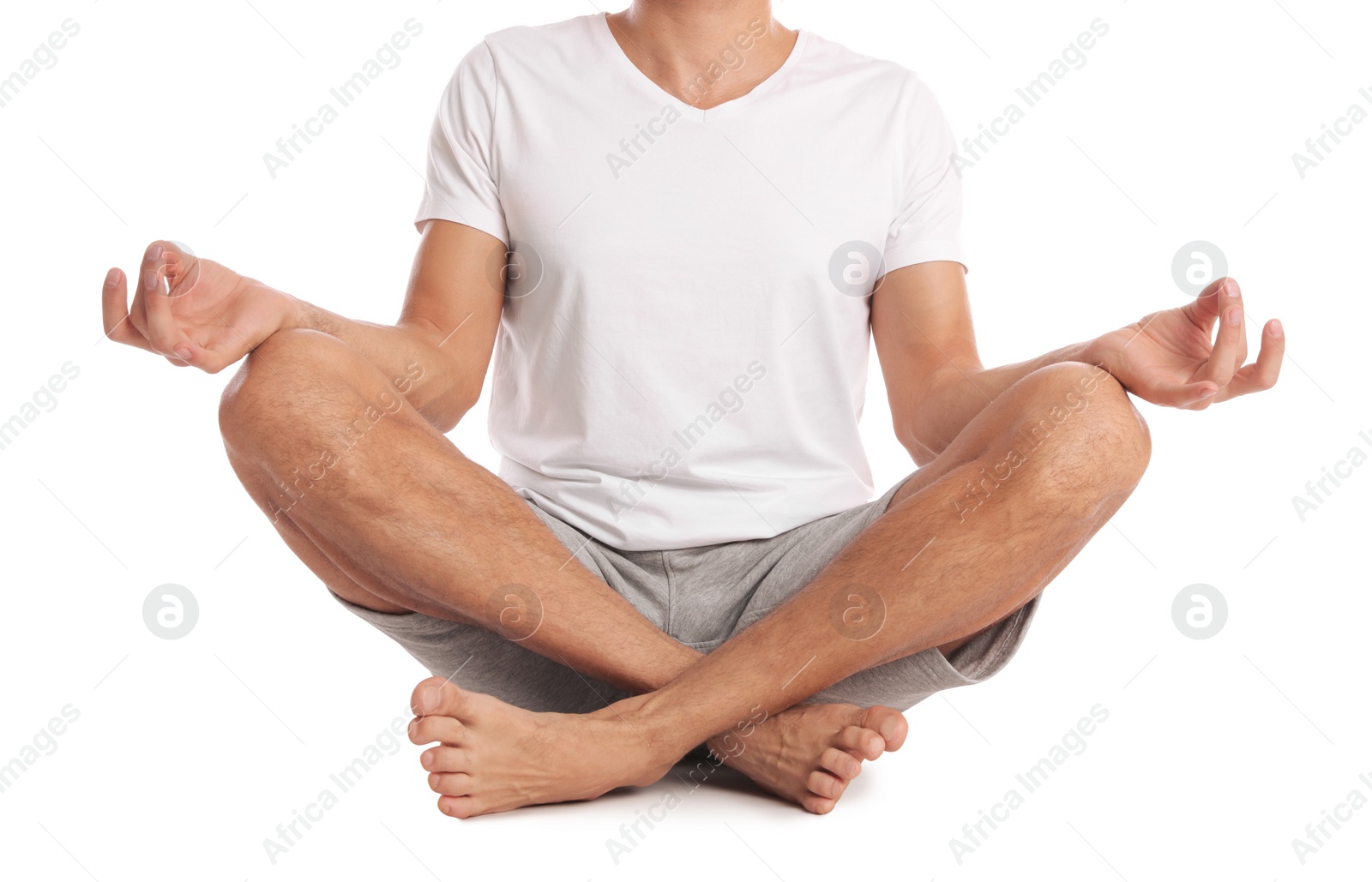 Photo of Man meditating on white background, closeup. Harmony and zen