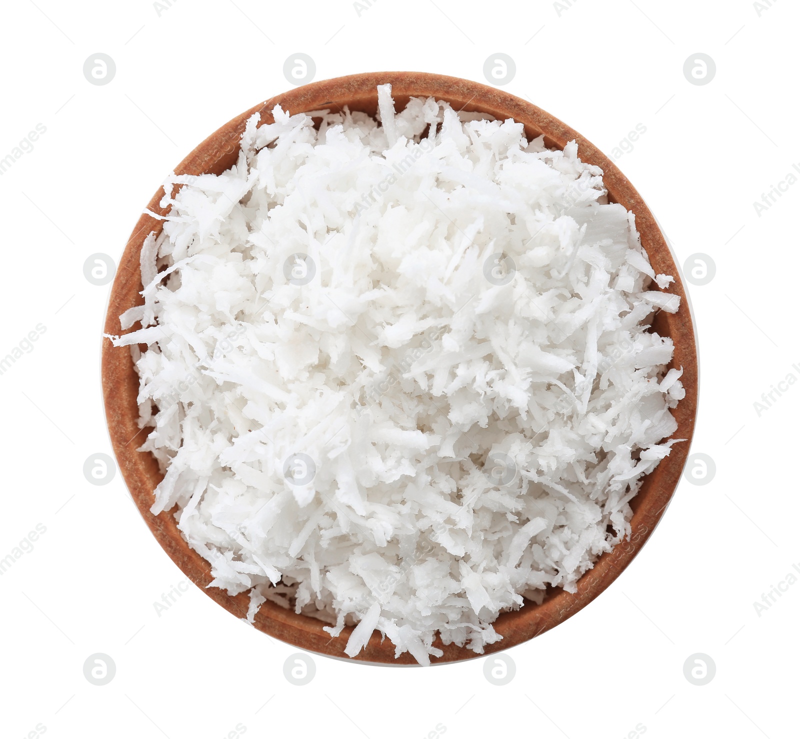 Photo of Fresh coconut flakes in bowl on white background, top view