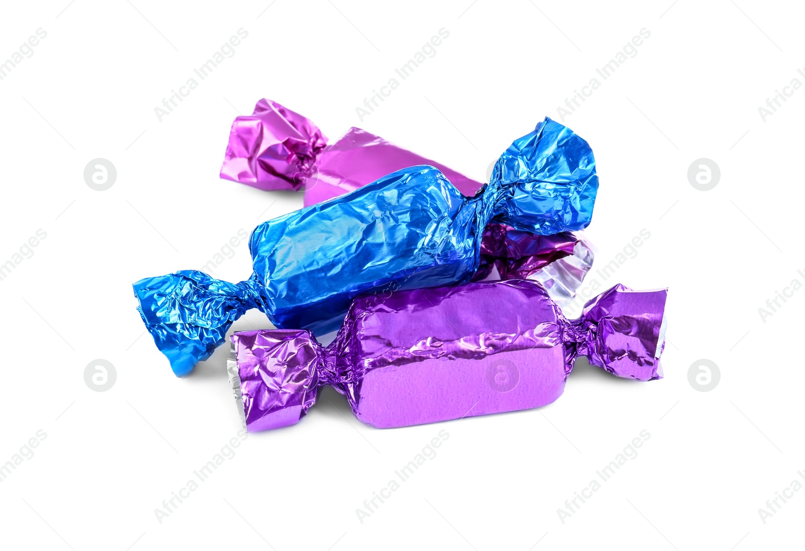 Photo of Tasty candies in colorful wrappers isolated on white